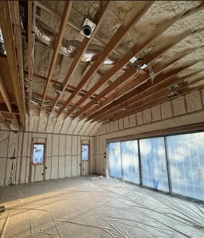 Interior walls and ceiling insulated with spray foam during new construction in Indiantown